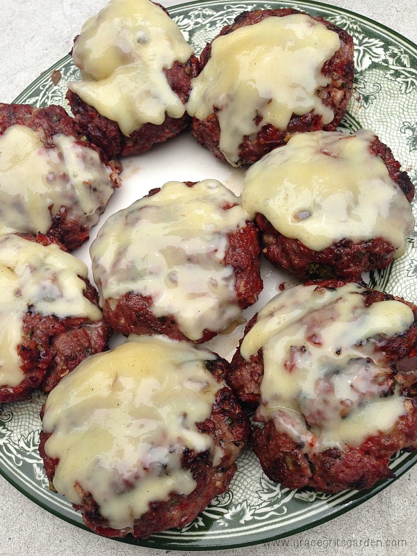 Grilled Basil Burgers topped with Fontina Cheese
